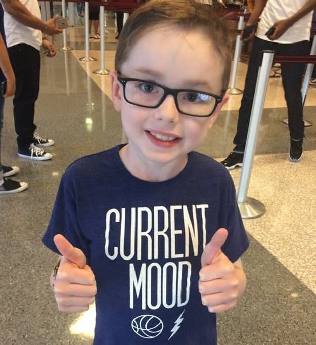Keaton Barrón smiling in glasses and giving two thumbs up
