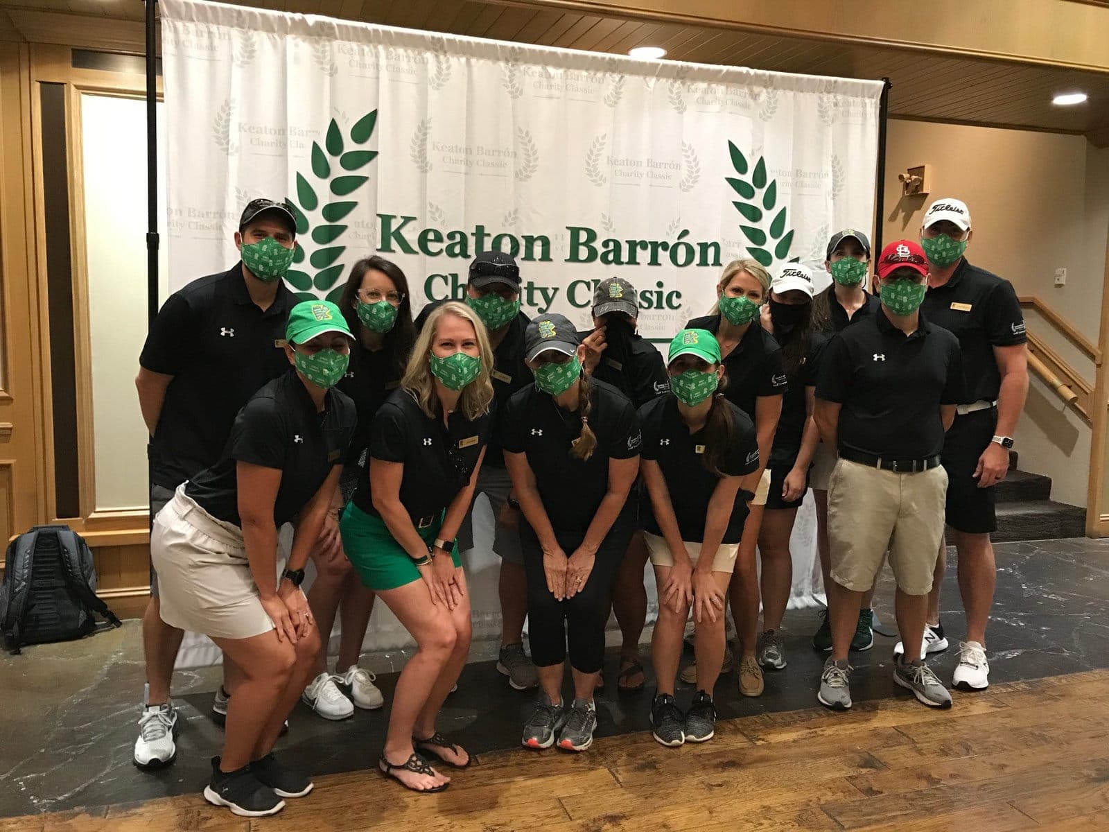 Volunteers in matching green shirts at the tournament