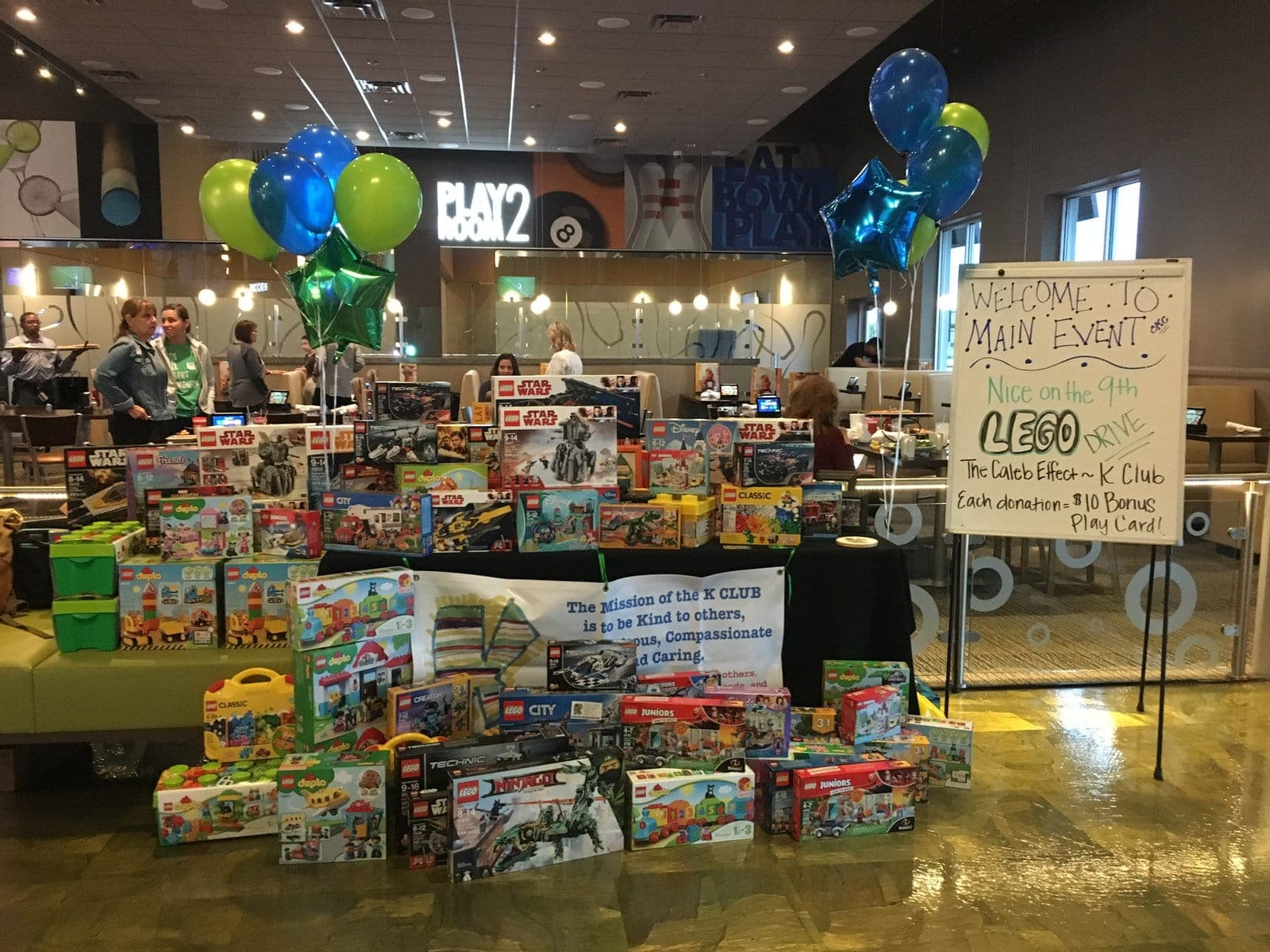 Tables of donated Lego sets at the Nice on the 9th Lego drive